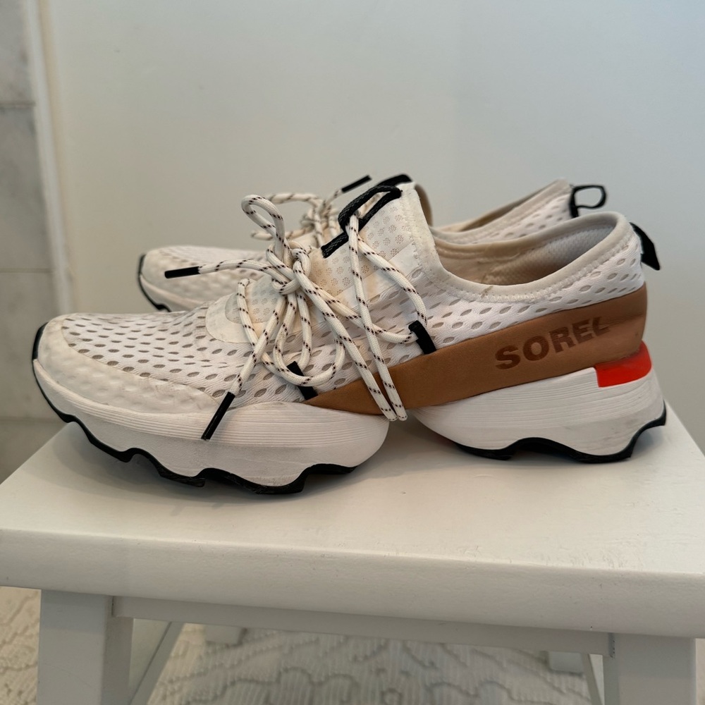 SOREL Kinetic Impact lace sneakers for women. White mesh, tan leather, orange